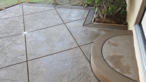 Stamped concrete patio with curved step