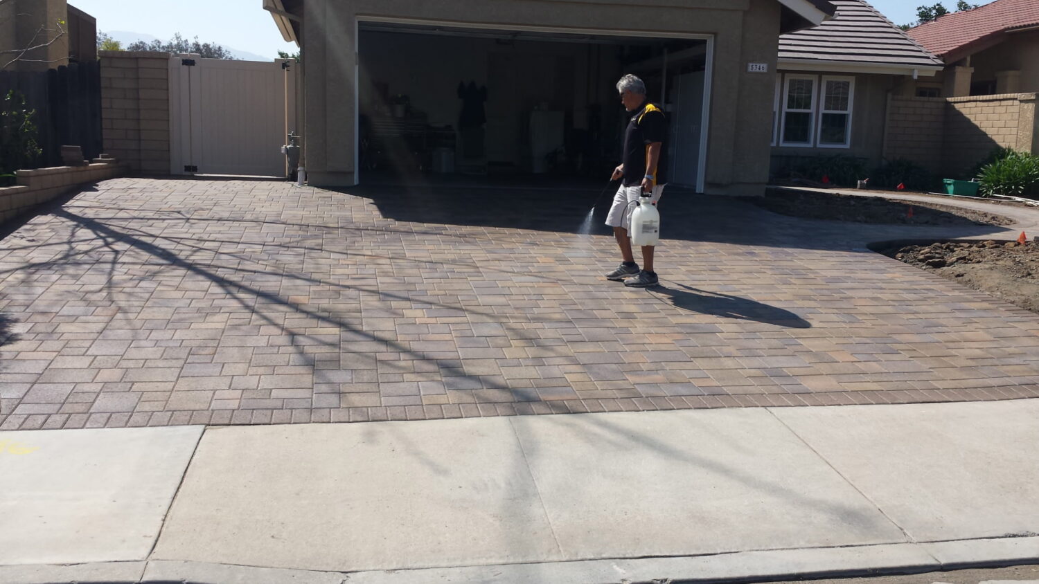 Venco Construction crew installing a paver driveway